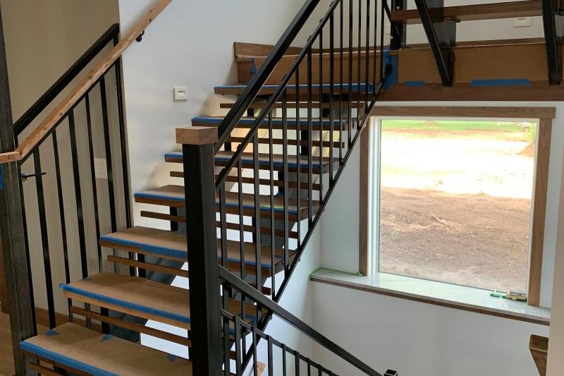 Custom metal staircase installation in progress